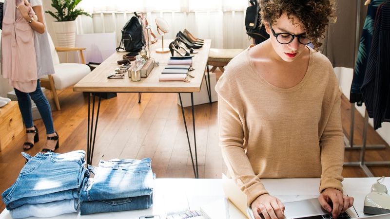 woman working in clothes shop